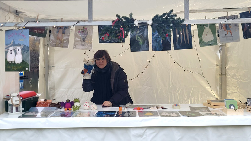 Marktstand mit Illustrationen